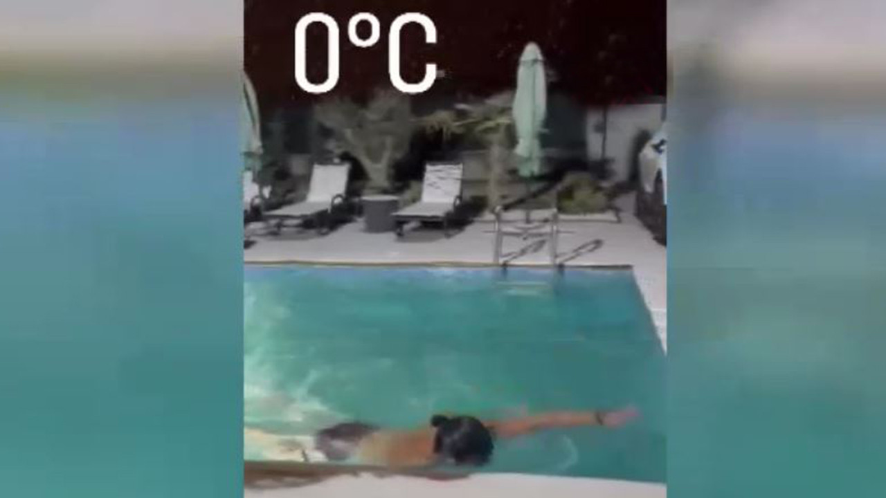 Amasya'da kar yağarken havuza girdi