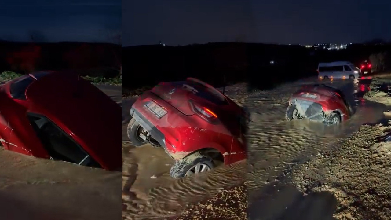 Çamurda can pazarı: Çöken yol otomobili yuttu: Yer İstanbul değil