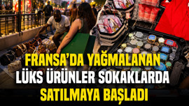 Fransa'da yağmalanan lüks ürünler sokaklarda satılmaya başladı