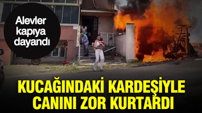 Kucağındaki kardeşiyle canını zor kurtardı: Alevler kapıya dayandı