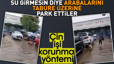 Su girmesin diye arabalarını tabure üzerine park ettiler